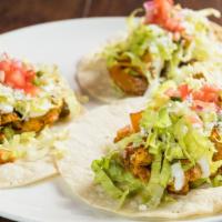 American Tacos · Gluten free. Chicken paned fried with achote oil top with sour cream and lettuce.