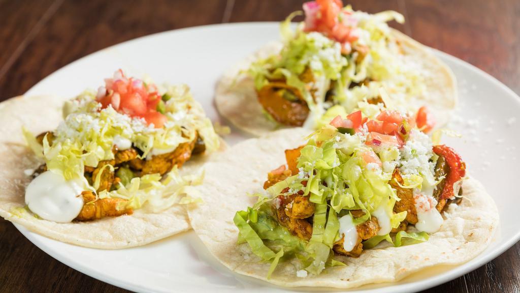 American Tacos · Gluten free. Chicken paned fried with achote oil top with sour cream and lettuce.