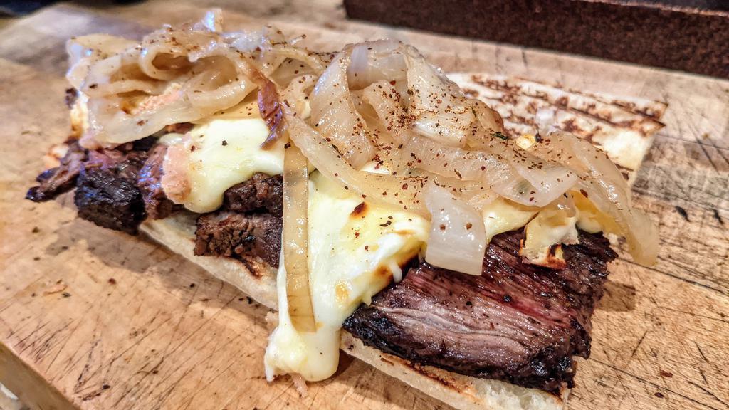 ..Any Day Anytime Sandwich · Roasted steak, sautéed onions, and raclette cheese. Served on a home-baked baguette.