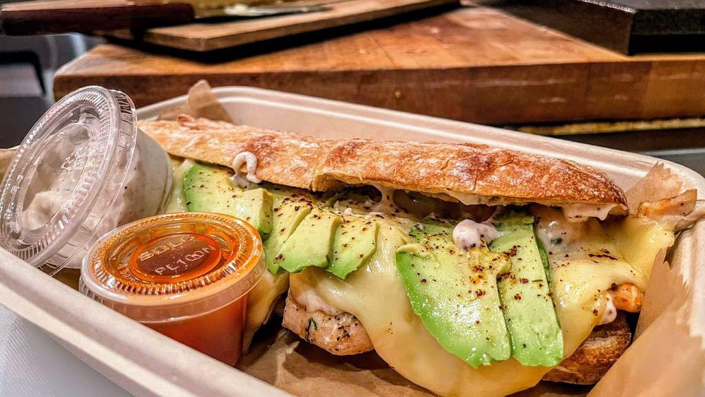 ..Keep It Light But Funky Sandwich · Grilled chicken, raclette cheese, sliced avocado, sumac mayo, and fresh lemon juice. Served on a home-baked baguette.