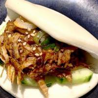 Spicy Pulled Pork Bun (1 Pc) · Spicy pulled pork, cucumber, green onion, sesame seed and mayo sauce.