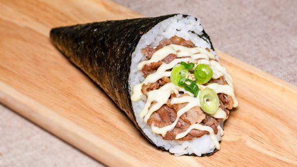 Sukiyaki Beef Hand Roll · 1 piece. Sukiyaki beef, scallions, and mayo sauce.