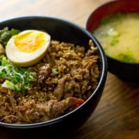 Sukiyaki Beef Don · Sliced beef, egg, green onion, mixed vegetables sesame seed and miso dressing. Served with m...