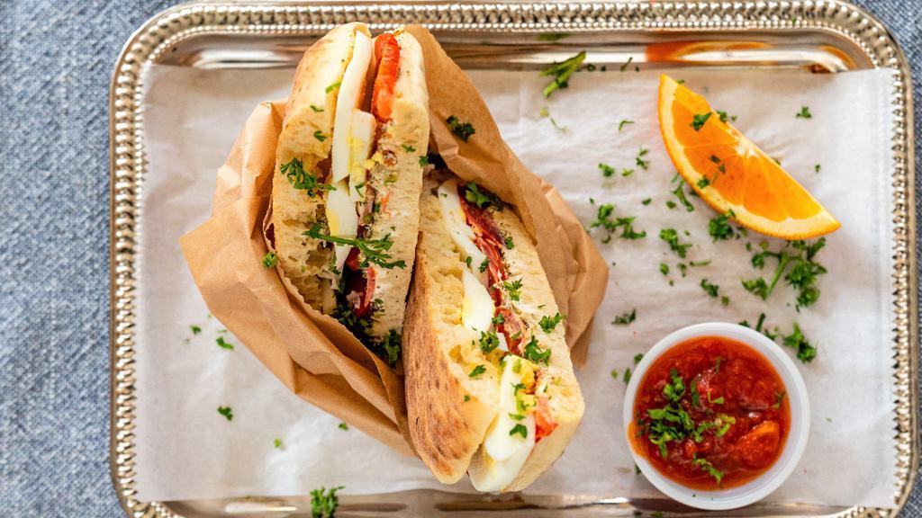 Pita Za'Atar · Pita bread filled with Lebanese cheese (mediterranean cheese), sliced fresh tomato, sizzling with za'atar herbs. Crispy grilled in the oven.