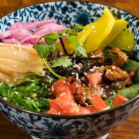 Daily Rice Bowl · Citrus soy, seaweed, pickled onions, and bamboo shoot with tahini dressing.