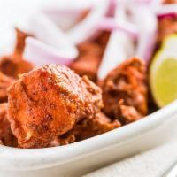 Chicken 65 · Boneless cubes of chicken marinated with Indian spices and deep fried.