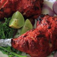 Tandoori Chicken Full  · Hot. Chicken marinated in yogurt/spices.