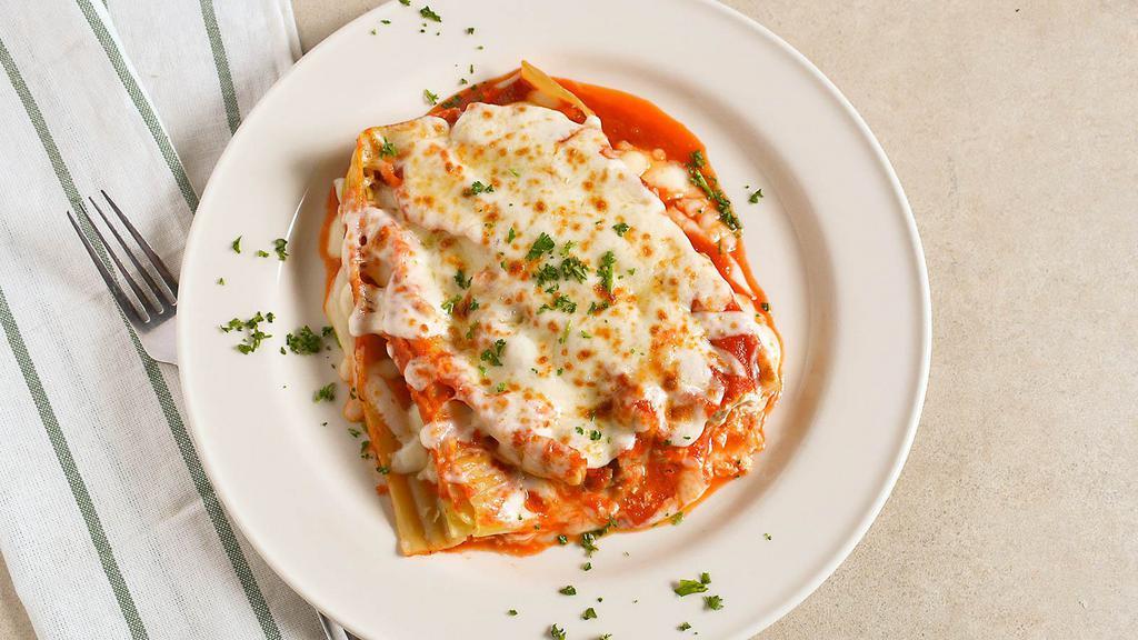 Lasagna · Fresh pasta, ricotta, mozzarella, and ragu of beef with tomato sauce.