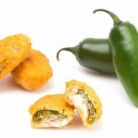 Jalapeno Poppers · Fresh jalapeno peppers stuffed with creamy cheese and spices.