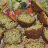Falafel Rice Platter · Seasoned basmati rice with fresh ground chick peas with vegetables and added Mediterranean s...