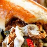Gourmet Mushroom Cheese Steak · Grilled 100% Steak topped with portobello mushrooms, peppers, onions and cheese on foot long...