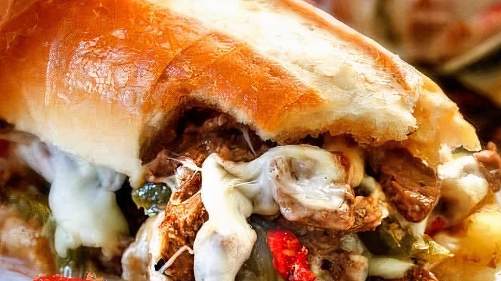 Gourmet Mushroom Cheese Steak · Grilled 100% Steak topped with portobello mushrooms, peppers, onions and cheese on foot long bread.