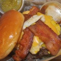 Gourmet Brunch Burger · Grilled 100% Beef, 8oz Burger topped with a fried egg, smoked bacon, cheese, lettuce, tomato...