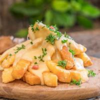 Cheese Fries · Fresh hand cut potatoes topped with melted cheese.