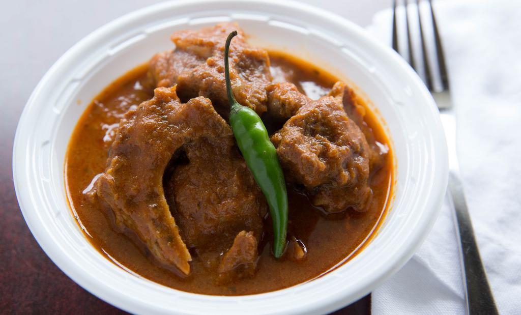 Goat Curry · Gluten-free. Hearty goat in a traditional savory curry served with a side of basmati rice.