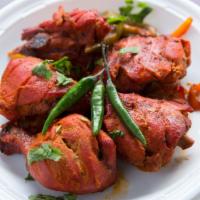 Chicken Tandoori · Gluten-free. Flavorful chicken drumsticks marinated and cooked in a traditional clay oven an...