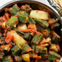 Bhindi Masala · Vegan and gluten-free. Tender okra sautéed in onions and tomatoes and served with a side of ...