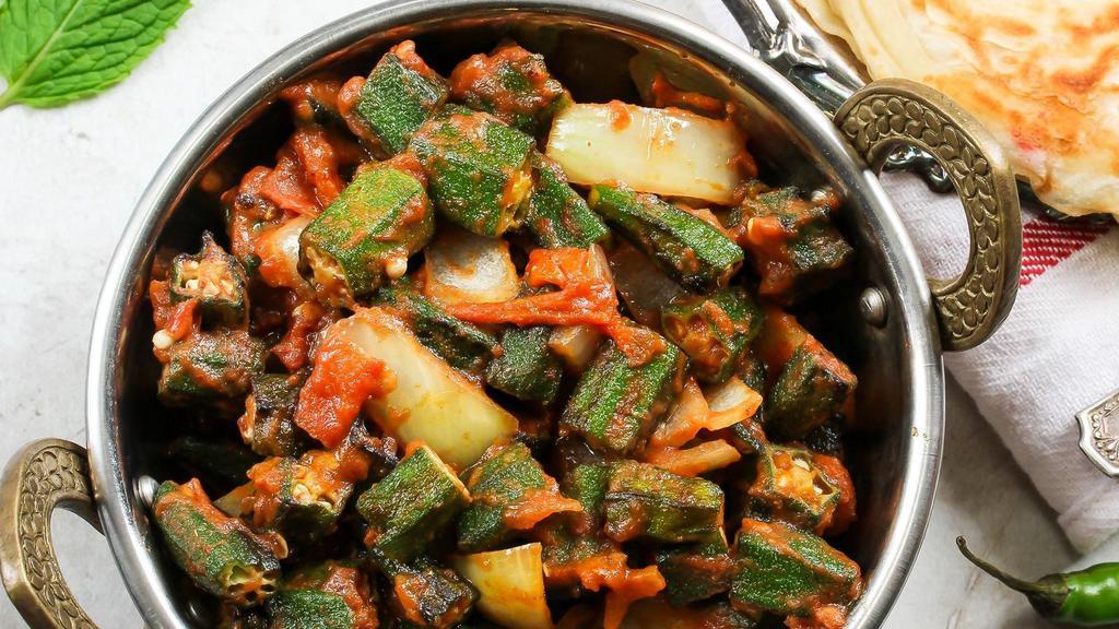 Bhindi Masala · Vegan and gluten-free. Tender okra sautéed in onions and tomatoes and served with a side of basmati rice.