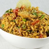 Bhel Puri · This savory snack mix includes puffed rice, puri and traditional chutneys.