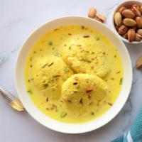 Rasmalai (2 Pcs) · Traditional Indian paneer cheese soaked in a sweet and creamy milk.