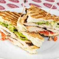 Grilled Chicken Delight Panini · Grilled chicken, homemade fresh mozzarella, leaf lettuce, roasted red peppers and pesto aioli.