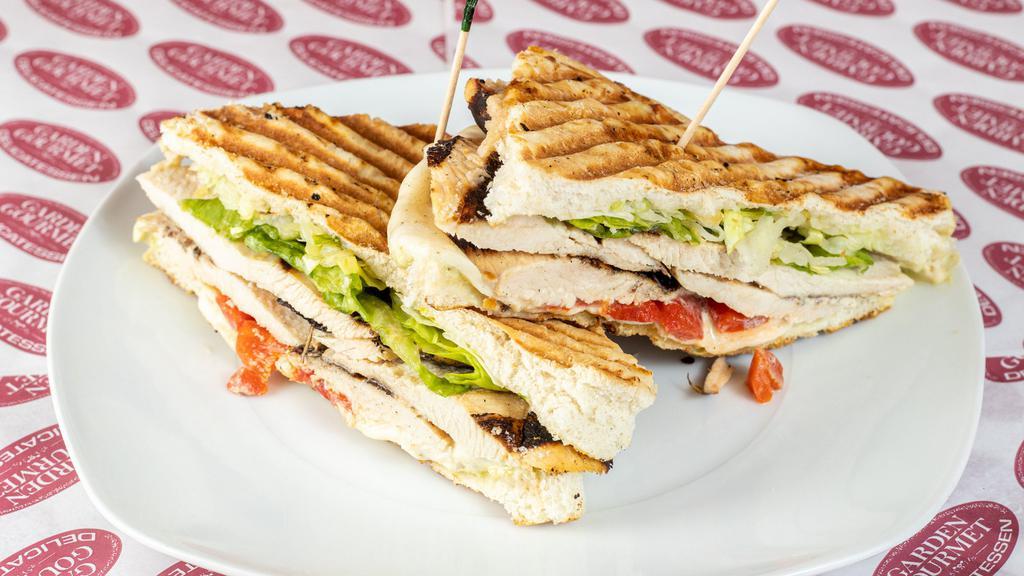 Grilled Chicken Delight Panini · Grilled chicken, homemade fresh mozzarella, leaf lettuce, roasted red peppers and pesto aioli.