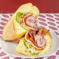 The God Father Sandwich · Genoa salami, pepperoni, ham cappy, prosciutto, provolone, lettuce, tomato, red onion, hot c...