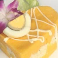 Causa Rellena · Cold mashed potato infused with key of lime juice, pressed into a cake and stuffed with choi...