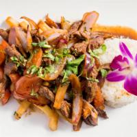 Lomo Saltado (Sirloin Top Steak) · Stir fried dish sauteed with onions, tomatoes and French fries served with rice.