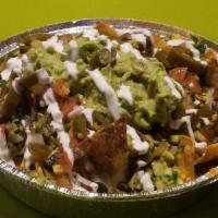 Nachos · Corn tortillas topped with melted mixed cheese, guacamole, sour cream, Oaxacan black beans, ...