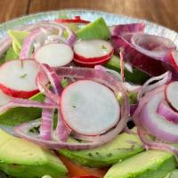 Ensalada De Aguacate (Guac Salad) · Fresh sliced avocados with pickled red onions, lettuce and sliced radish.  Add your favorite...