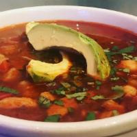 Pozole De Pollo · Mexican Chiles - tomato chicken broth, with hominy, tomatoes, peppers, onions, topped with c...