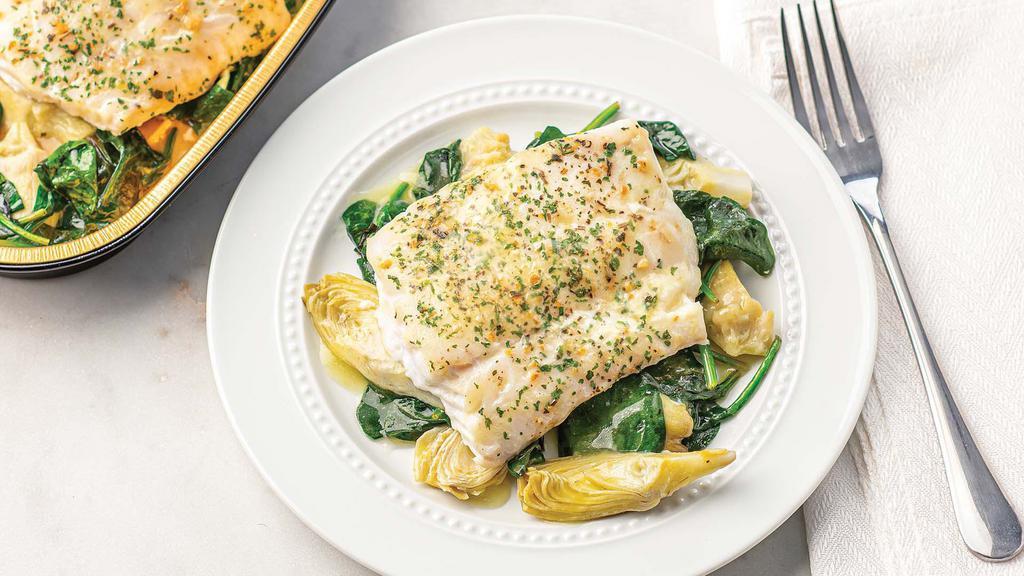 Mediterranean Style Cod (Ready To Cook) – 14 Oz. · Ready to cook, our mild, flaky wild-caught Icelandic cod fillet is served over baby spinach and artichoke hearts in a bright lemon butter sauce, then sprinkled with briny capers and a blend of orange and ginger seasoning. This item comes uncooked and ready for your oven with no prep or cleanup!