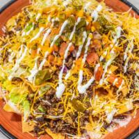 Nachos · Choice of meat, beans, queso blanco, lettuce, jalapeno pico de gallo and sour cream.