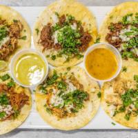 Traditional Tacos · choice of meat, corn tortilla, cilantro and onions