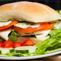 Margarita Sandwich · Fresh mozzarella cheese, tomato, arugula, pesto spread on ciabatta bread.