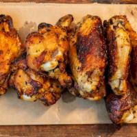 Wood Fired Rosemary Wings · Blue cheese dipping sauce.