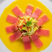 Tunita Apassionada · Ahi tuna - passion fruit sauce - coleslaw Napa cabbage.