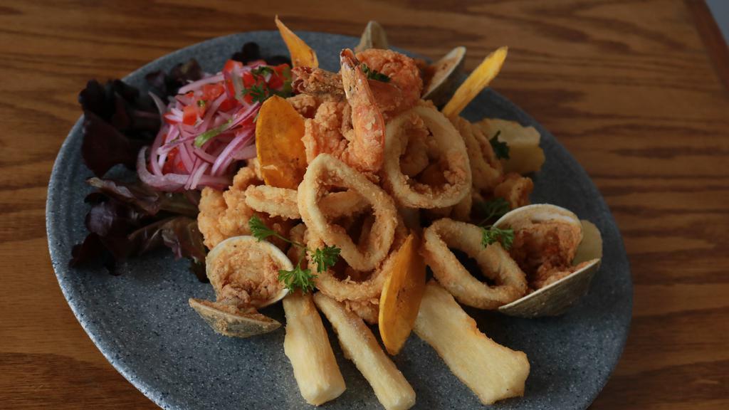 Jaleita · Catch of the day - lightly fried seafood - cassava - salsa criolla.