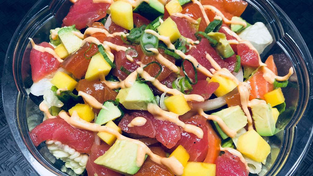 Sushi Salad · Fresh salmon, tuna, lettuce, cucumber, tomato, mango, avocado with spicy mayonnaise, onion, and scallion.