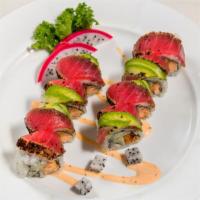 Teriyaki Roll · Cooked salmon and cucumber. Topped with peppered tuna, avocado, and eel sauce.