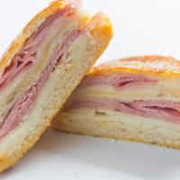 Monte Cristo Panini · Delicious Panini made with Black Forest ham, turkey breast, Muenster cheese and Russian dres...