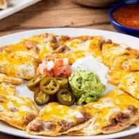 Grande Bean & Cheese Nachos · Tostada chips topped with refried beans and melted mixed cheese. Served with guacamole, sour...