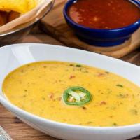 Border Queso · Our signature queso mixed with our salsa verde for an extra kick.
