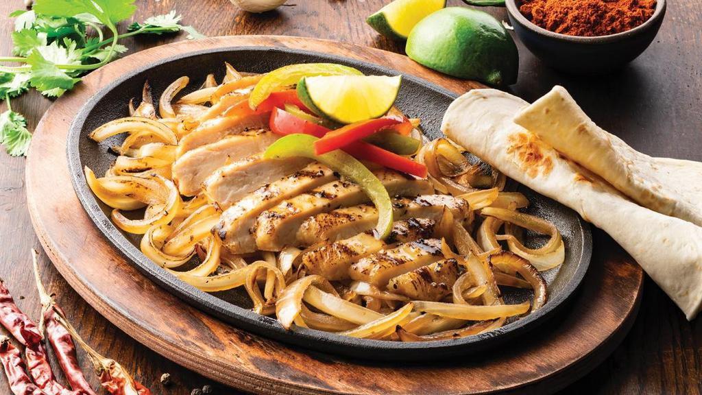 Classic Fajitas · Our famous fajitas are grilled over mesquite wood and served with hand-pressed flour tortillas, pico de gallo, cheese, Mexican rice and choice of beans.
