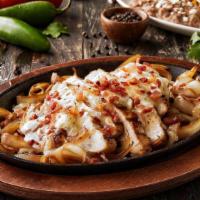 Monterey Ranch Chicken Fajitas · Mesquite-grilled chicken smothered with melted Jack cheese, crumbled bacon and ranch dressin...