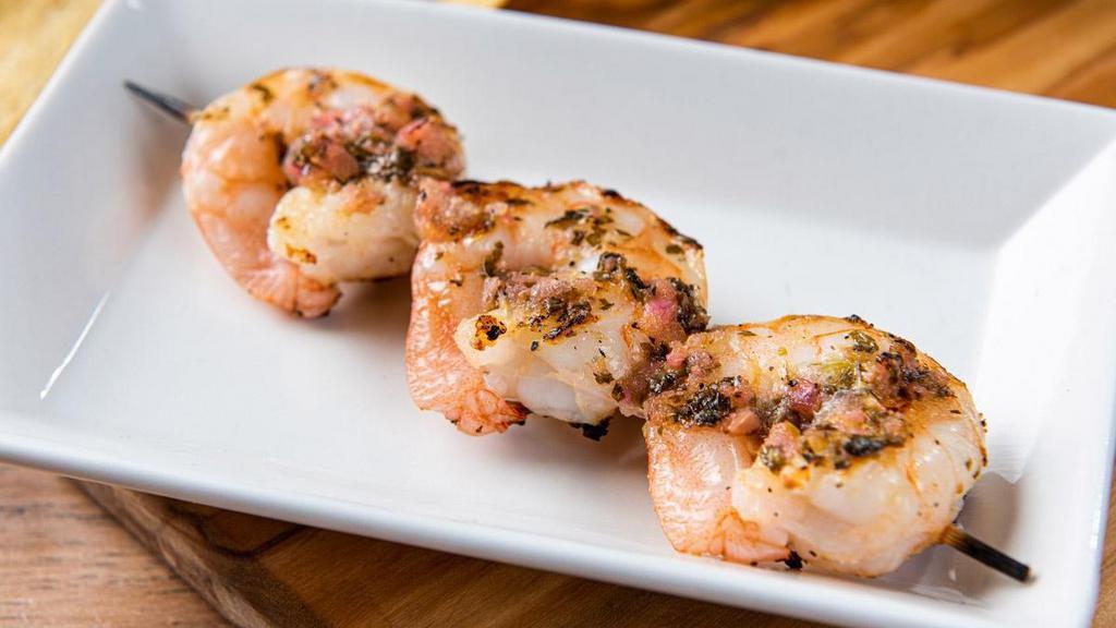 Grilled Shrimp Skewer  · A skewer with three mesquite-grilled shrimp brushed with lime cilantro chimichurri.