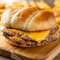 Classic Cheeseburger · Two beef patties topped with melted American cheese, mayonnaise and ketchup on a toasted bun...