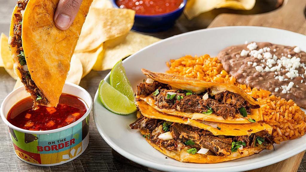 Birria Quesa Tacos · Beef barbacoa, Mexican cheese, diced onion and cilantro in crispy flour tortillas. Served with hot consommé for dipping, Mexican rice and choice of beans.