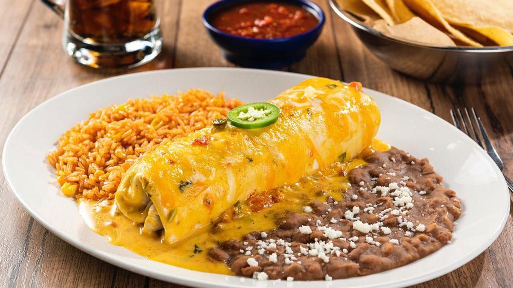 Bean & Cheese Burrito · Refried beans and mixed cheese rolled in a flour tortilla smothered with chile con carne, sour cream sauce, green chile sauce, roasted red chile tomatillo salsa or our signature queso. Served with Mexican rice and choice of beans.